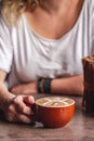 Coffee latte art with floral shape in coffee shop