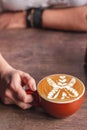 Coffee Latte Art with Floral Shape in Coffee Shop