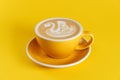 Coffee latte art on yellow background