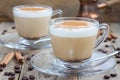 Coffee latte with cinnamon in glass cups