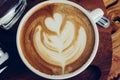 Coffee latte cup on a wood table