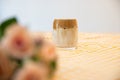 Coffee Latte with flower decorations and yellow table cloth.Dalgona Coffee in a glass Royalty Free Stock Photo