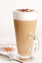 Coffee latte with frothy milk in tall glass Royalty Free Stock Photo