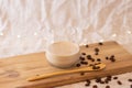 Coffee latte in glass on wooden stand background with coffee beans Royalty Free Stock Photo