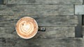 Coffee latte heart texture on wooden floor