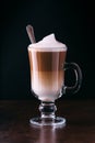 Coffee latte macchiato on a black background Royalty Free Stock Photo