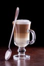 Coffee latte macchiato on a black background