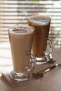 Coffee latte macchiato in tall glasses