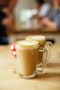 Coffee latte in two tall glasses and sugar bowl Royalty Free Stock Photo