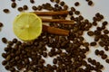 Coffee, lemon and cinnamon on a white background