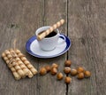 Coffee, linking of cookies and forest nutlets on a table