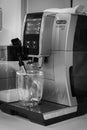 Coffee machine Delonghi in a cafe, black and white. Cappuccino maker. Morning drinks. Hot drinks. Royalty Free Stock Photo