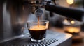 A coffee machine dispenses espresso, capturing the rich brewing process in a Royalty Free Stock Photo