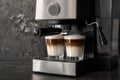 Coffee machine making latte on dark table Royalty Free Stock Photo
