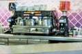 Coffee machine for the preparation of espresso coffee in a coffee shop. Blurred for use as a textured background Royalty Free Stock Photo