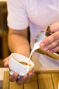 Coffee machine prepares espresso in to glass