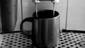 Coffee machine is preparing espresso- black and white