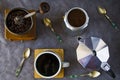 Coffee makers and beans, cup of coffee and spoons Royalty Free Stock Photo