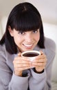 Coffee makes everything better. a beautiful young woman enjoying a cup of coffee in the morning. Royalty Free Stock Photo