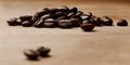 Coffee makes everything possible. Still life shot of coffee beans on a wooden countertop.