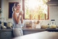 Coffee makes the world a better place. a young woman having her morning coffee. Royalty Free Stock Photo