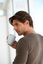 Coffee, memory and young man at apartment with thinking, vision or reflection face expression. Handsome, morning and