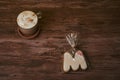 Coffee with milk and books on a brown wooden table. Royalty Free Stock Photo