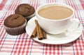 Coffee with milk, cinnamon and muffins Royalty Free Stock Photo
