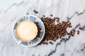 Coffee milk in a cup on marble table. Royalty Free Stock Photo