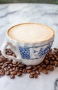 Coffee milk in a cup on marble table. Royalty Free Stock Photo