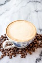 Coffee milk in a cup on marble table. Royalty Free Stock Photo