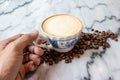 Coffee milk in a cup on marble table. Royalty Free Stock Photo
