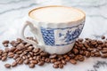 Coffee milk in a cup on marble table. Royalty Free Stock Photo
