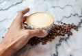 Coffee milk in a cup on marble table. Royalty Free Stock Photo