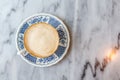 Coffee milk in a cup on marble table. Royalty Free Stock Photo