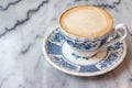 Coffee milk in a cup on marble table. Royalty Free Stock Photo