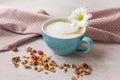 Coffee with milk and different grains, cereals and candied fruits. Royalty Free Stock Photo