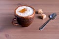 Coffee with milk in a fired earthenware mug Royalty Free Stock Photo