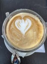 Coffee with milk with a heart made of foam Royalty Free Stock Photo