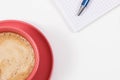 Coffee with milk and notepad for writing notes. Work or relaxation. White background. Place for text