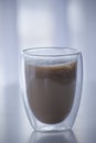Coffee With Milk In A Transparent Glass With A Double Bottom. A Popular Drink In An Original Glass.