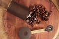 Coffee beans overflowing from the coffee mill Royalty Free Stock Photo