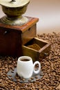 coffee mill with coffee beans and cup of coffee Royalty Free Stock Photo