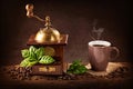 Coffee mill and a cup of coffee