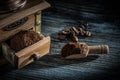 Coffee mill scoop grains on wooden board Royalty Free Stock Photo