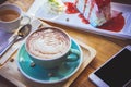 coffee mocha lattee cup on wood table and cake relax time on cafe shop Royalty Free Stock Photo