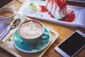 coffee mocha lattee cup on wood table and cake relax time on cafe shop Royalty Free Stock Photo