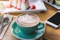 coffee mocha lattee cup on wood table and cake relax time on cafe shop Royalty Free Stock Photo