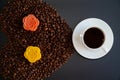 Black coffee and colorful Chinese mooncakes on the coffee beans with black background Royalty Free Stock Photo