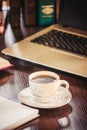 Coffee morning in the workplace. with a book or laptop. selective focus. Royalty Free Stock Photo